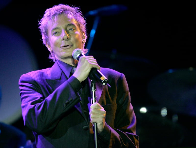 Music recording artist Barry Manilow performs Elton John's song "Your Song" at the 14th annual Ella awards at the Beverly Hilton hotel in Beverly Hills on October 10, 2005.