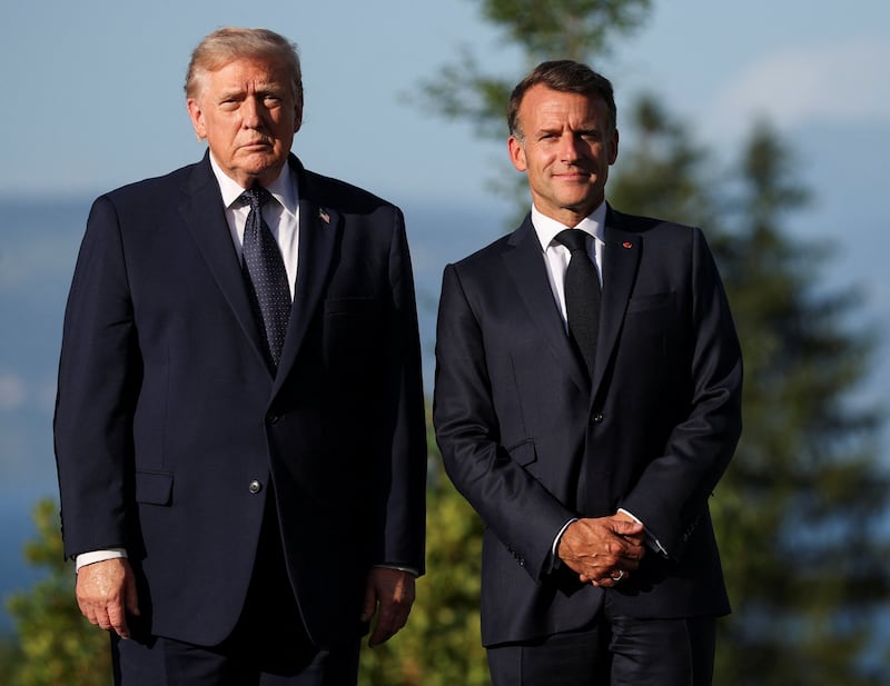French President Emmanuel Macron poses with U.S. President Donald Trump during the G7 summit in Evian-les-Bains, France, June 15, 2026. REUTERS/Isabel Infantes/Pool