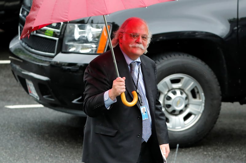 Ty Cobb walks to his car at the White House 2018.  REUTERS/Jonathan Ernst.