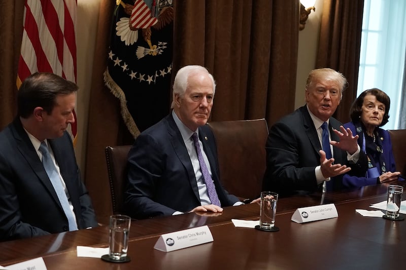 U.S. President Donald Trump (3rd L) speaks as (L-R) Sen. Christopher Murphy (D-CT), Senate Majority Whip Sen. John Cornyn (R-TX) and Sen. Dianne Feinstein (D-CA) listen