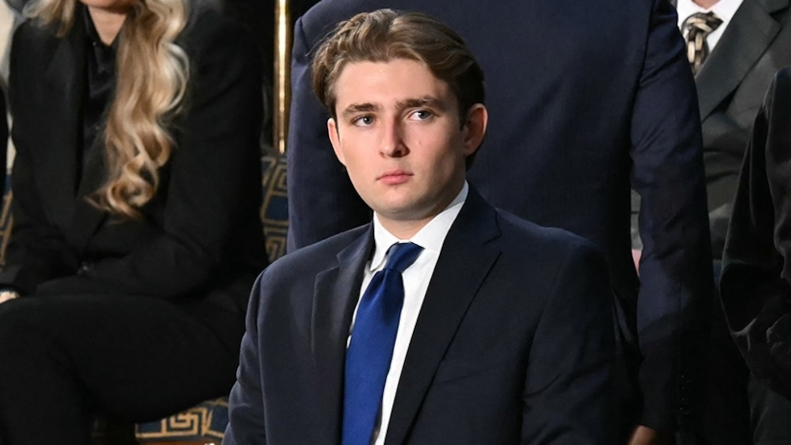 Barron Trump, son of US President Donald Trump, stands before the arrival of President Trump for the State of the Union address in the House Chamber of the US Capitol in Washington, DC, on February 24, 2026.
