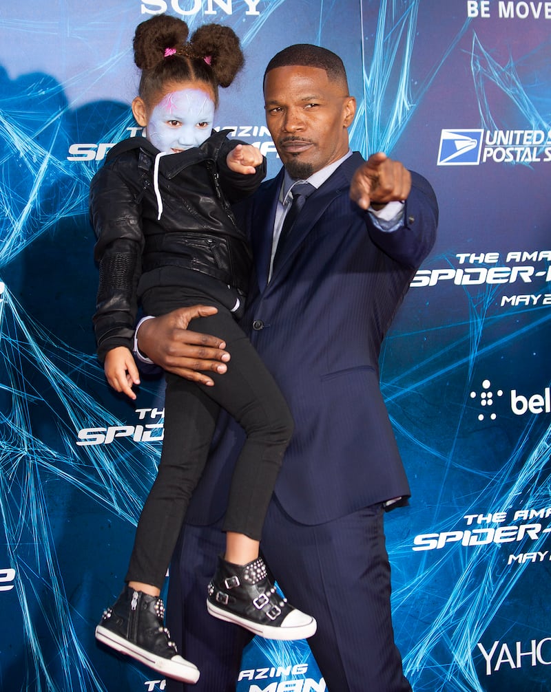 Actor Jamie Foxx with second daughter Annaliseat the "The Amazing Spider-Man 2" premiere in 2014. Analise has her face painted like Electro, the role her father plays in the film.  REUTERS/Carlo Allegri (UNITED STATES - Tags: ENTERTAINMENT)
