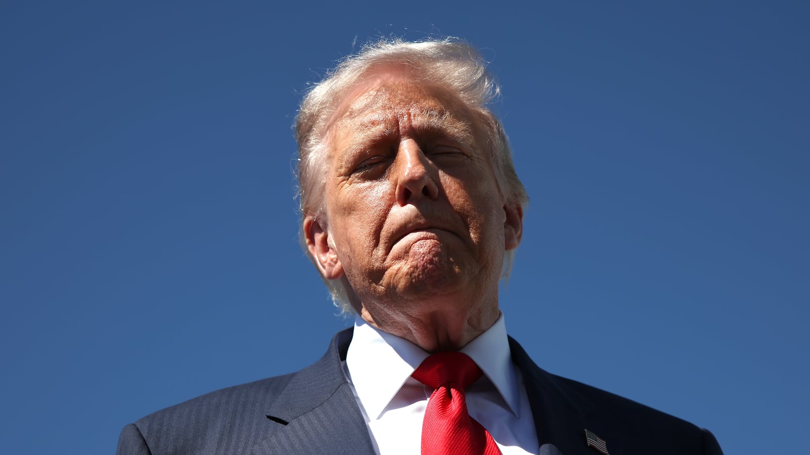 WEST PALM BEACH, FLORIDA - OCTOBER 31: US President Donald Trump speaks to reporters as he arrives at Palm Beach International Airport on October 31, 2025 in West Palm Beach, Florida. Trump is spending the weekend at his Mar-A-Lago estate in Palm Beach, Florida. (Photo by Samuel Corum/Getty Images)