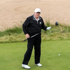 BALMEDIE,SCOTLAND - JULY 29: U.S. President Donald Trump tees off after opening his new golf course at his Trump International Golf links resort on July 29, 2025 in Balmedie, Scotland. U.S. President Donald Trump is visiting his Trump Turnberry golf course, as well as Trump International Golf Links in Aberdeenshire, during a brief visit to Scotland from July 25 to 29. (Photo by Jeff J Mitchell/Getty Images)