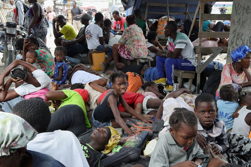 Residents rest while fleeing their homes near Cite Soleil after rival gang clashes in Haiti's capital worsened over the weekend, in Port-au-Prince, Haiti, May 11, 2026. REUTERS/Fildor Pq Egeder