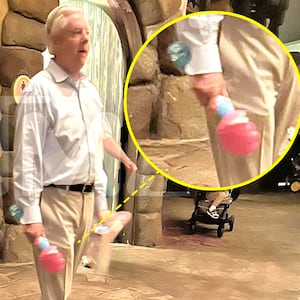 Sen. Lindsey Graham walking with a bubble wand at Disney World.