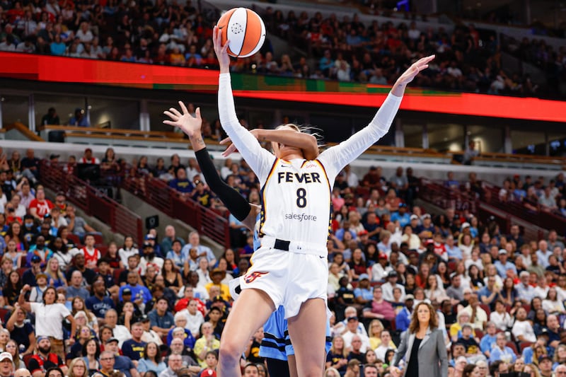 Indiana Fever guard Sophie Cunningham (8) is fouled by Chicago Sky guard DiJonai Carrington (7) as she drives to the basket during the first half at United Center.