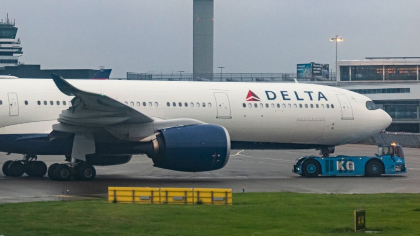 Delta Air Lines Airbus A330-900neo wide body passenger aircraft spotted while towed in Amsterdam Schiphol Airport AMS EHAM with the air traffic control tower visible, towards the gates of the airport terminal to operate the flight DL143, departing to Seattle SEA in the USA. The Airbus A330 - 900 airplane is powered by 2x RR jet engines and has the registration tail number N420DX. Delta or DAL is a major airline of the United States of America, a legacy carrier with headquarters in Atlanta, Georgia member of SkyTeam aviation alliance. Delta is the second largest airline in the world by passenger traffic and fleet size. Amsterdam, Netherlands on April 11, 2024 (Photo by Nicolas Economou/NurPhoto via Getty Images)