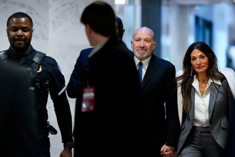U.S. Commerce Secretary Howard Lutnick holds his wife, Allison Lutnick's hand, as he arrives to testify before the Senate Appropriations Subcommittee on Commerce, Justice, Science, and Related Agencies hearing to examine a review of broadband deployment funding at the Department of Commerce, on Capitol Hill in Washington, D.C., U.S., February 10, 2026. REUTERS/Elizabeth Frantz