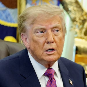 U.S. President Donald Trump holds an executive order renaming Lake Ontario as Lake America after signing it at the Oval Office of the White House in Washington, D.C., U.S., August 27, 2026. REUTERS/Evan Vucci