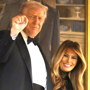 Donald Trump and first lady Melania Trump arrive at the Congressional Ball at the Grand Foyer of the White House on December 11, 2025 in Washington, DC.