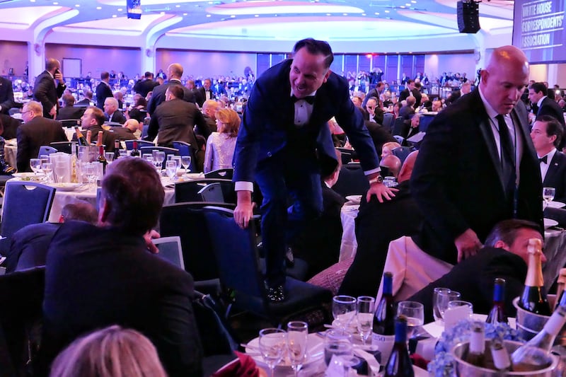 Dan Scavino jumps over a chair after an incident at the annual White House Correspondents Association Dinner April 25, 2026 in Washington, DC.