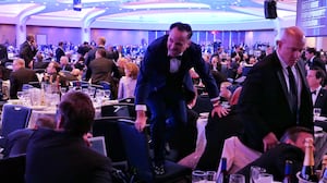 Dan Scavino jumps over a chair after an incident at the annual White House Correspondents Association Dinner April 25, 2026 in Washington, DC.