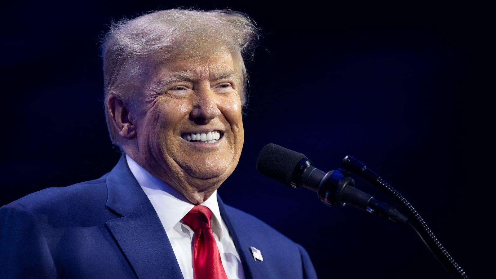Donald Trump smiles as he speaks during the Turning Point Action Conference in West Palm Beach, Florida, July 15, 2023.