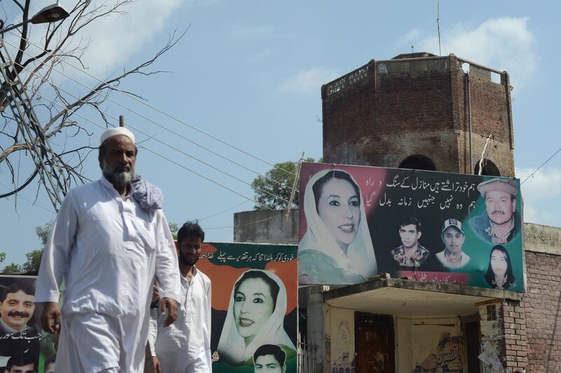 articles/2013/08/21/pakistan-s-murder-mystery/130820-Haqqani-Musharraf-tease_wqpo3x