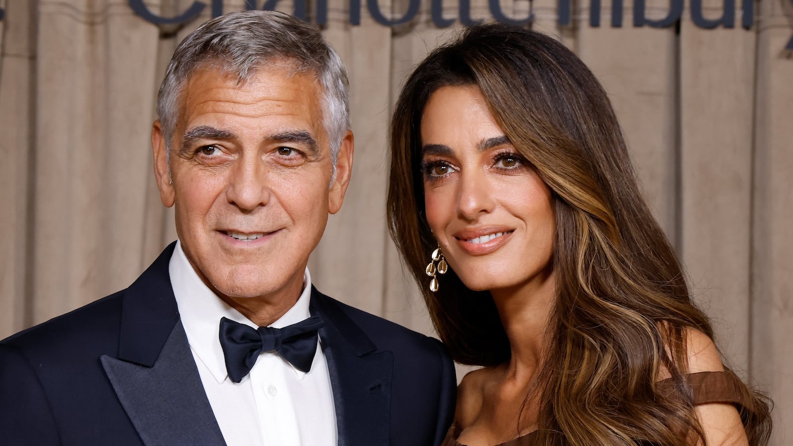 LONDON, ENGLAND - OCTOBER 03: George Clooney and Amal Clooney attend the Clooney Foundation For Justice's The Albies at The Natural History Museum on October 03, 2025 in London, England.