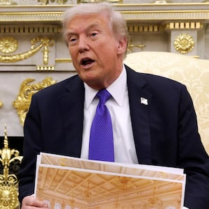 WASHINGTON, DC - OCTOBER 22: U.S. President Donald Trump displays a rendering of his proposed $250 million White House ballroom as he meets with NATO Secretary General Mark Rutte (L) in the Oval Office of the White House on October 22, 2025 in Washington, DC. Less than a week after hosting Ukrainian President Volodymyr Zelensky, Trump is meeting with Rutte to discuss the war in Ukraine. (Photo by Alex Wong/Getty Images)