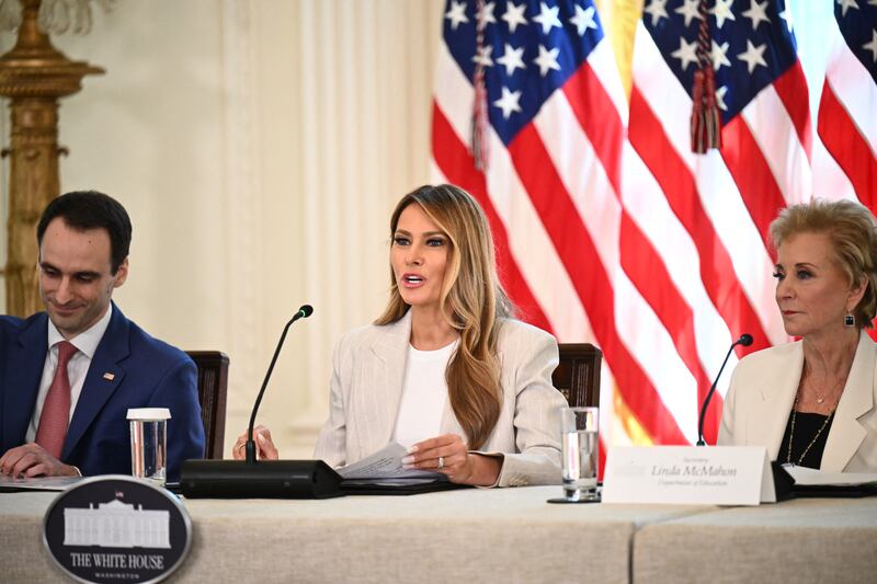 Trump speaks at Thursday's AI task force meeting next to Secretary of Education Linda McMahon (R) and US Director of the Office of Science and technology policy Michael Kratsios (L).