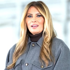 US First Lady Melania Trump speaks prior to making care packages for deployed members of the US military during an American Red Cross holiday event with military families at Joint Base Andrews in Maryland, December 1, 2025.