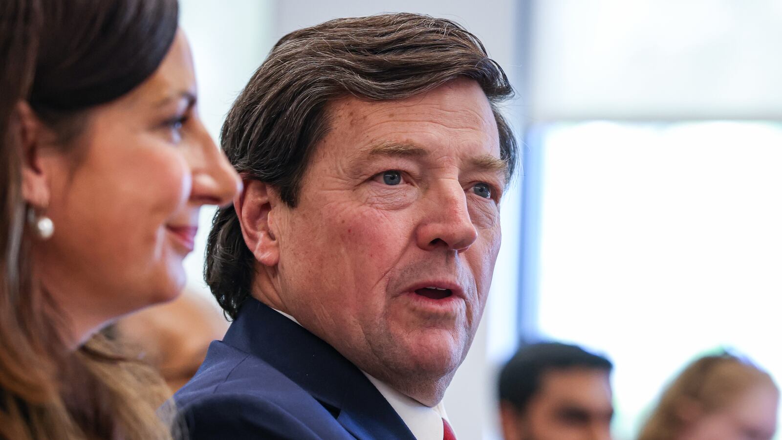 The woman accused of spitting on Ed Martin has been charged with assault.