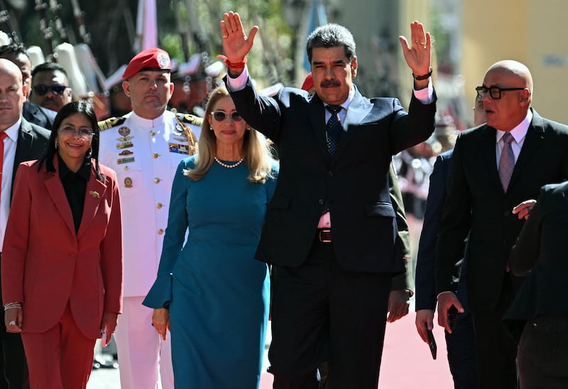 Venezuela's President Nicolas Maduro (2nd R) waves next to First Lady Cilia Flores, Vice President Delcy Rodriguez (L) and the president of the National Assembly Jorge Rodriguez on arrival at the Capitolio -house of the National Assembly- for the presidential inauguration, in Caracas on January 10, 2025. Maduro, in power since 2013, will take the oath of office for a third term despite a global outcry that brought thousands out in protest on the ceremony's eve. (Photo by Federico PARRA / AFP) (Photo by FEDERICO PARRA/AFP via Getty Images)