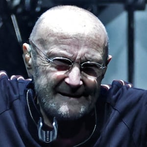 British singer Phil Collins (C) performs on stage during "The last domino" tour of the British rock band Genesis at the Paris La Defense Arena, in Nanterre, northeastern France, on March 16, 2022. (Photo by THOMAS COEX / AFP) (Photo by THOMAS COEX/AFP via Getty Images)