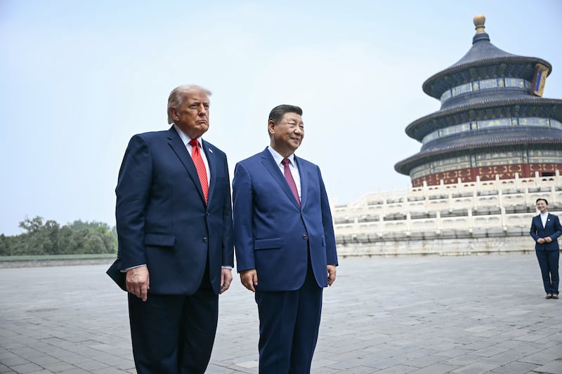 BEIJING, CHINA - MAY 14: China's President Xi Jinping (R) and US President Donald Trump visit the Temple of Heaven on May 14, 2026 in Beijing, China. Xi warned Trump that the issue of Taiwan could push their two countries into "conflict" if mishandled, a stark opening salvo as a superpower summit set to tackle numerous thorny issues began in Beijing on May 14. (Photo by Brendan Smialowski - Pool/Getty Images)
