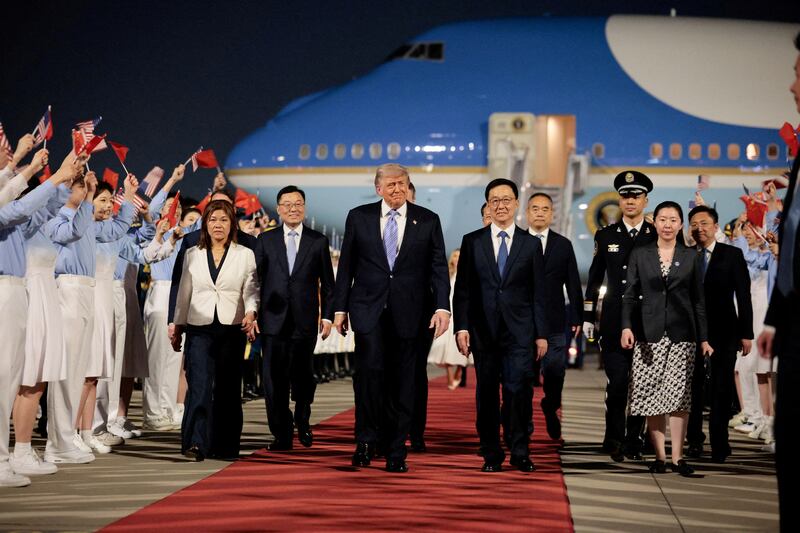 U.S. President Donald Trump walks with Chinese Vice President Han Zheng during an arrival ceremony at Beijing Capital International Airport, in Beijing, China, May 13, 2026. REUTERS/Evan Vucci     TPX IMAGES OF THE DAY