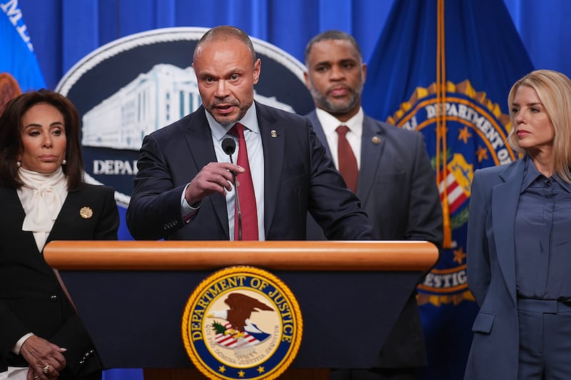 Dan Bongino, Deputy Director of the FBI, flanked by Attorney General Pam Bondi (R).