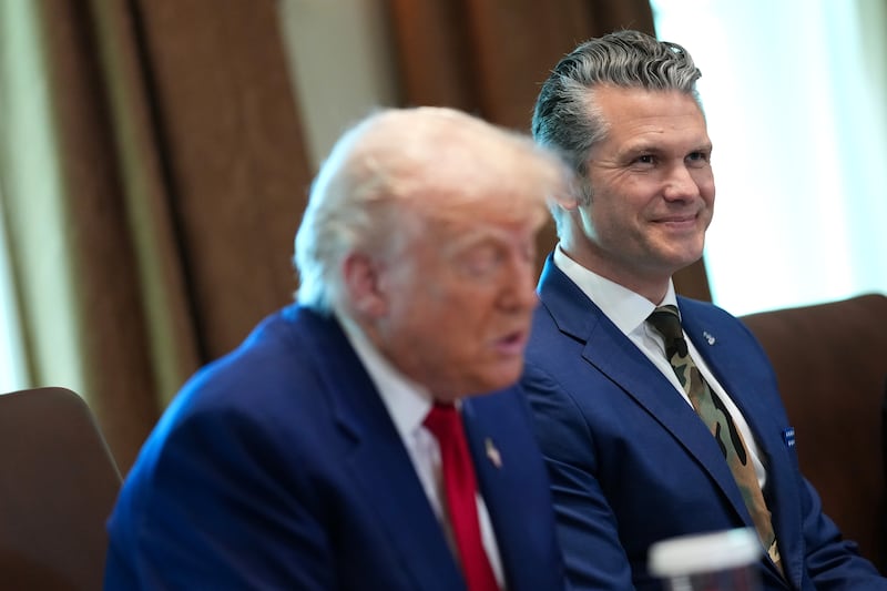Defense Secretary Pete Hegseth (R) looks on as U.S. President Donald Trump speaks during a Cabinet meeting at the White House on April 30, 2025 in Washington, DC.