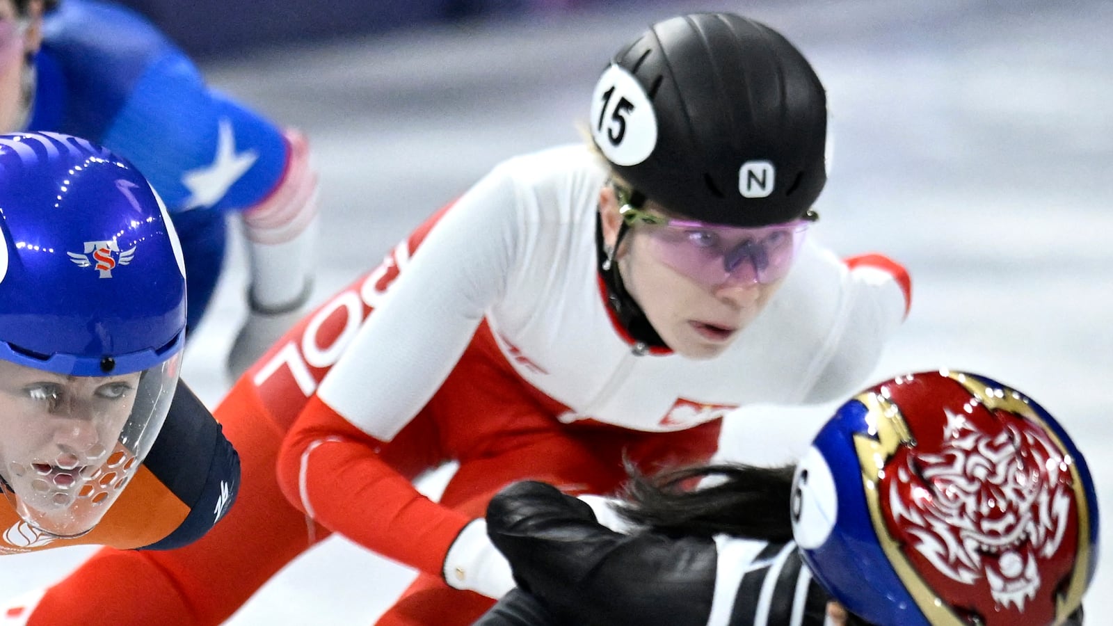 (R-L) South Korea's Kim Gil-li, Poland's Kamila Sellier, Netherlands' Michelle Velzeboer and USA's Julie Letai compete in the short track speed skating women's 1000m heats during the Milano Cortina 2026 Winter Olympic Games at Milano Ice Skating Arena in Milan on February 14, 2026. (Photo by WANG Zhao / AFP via Getty Images)