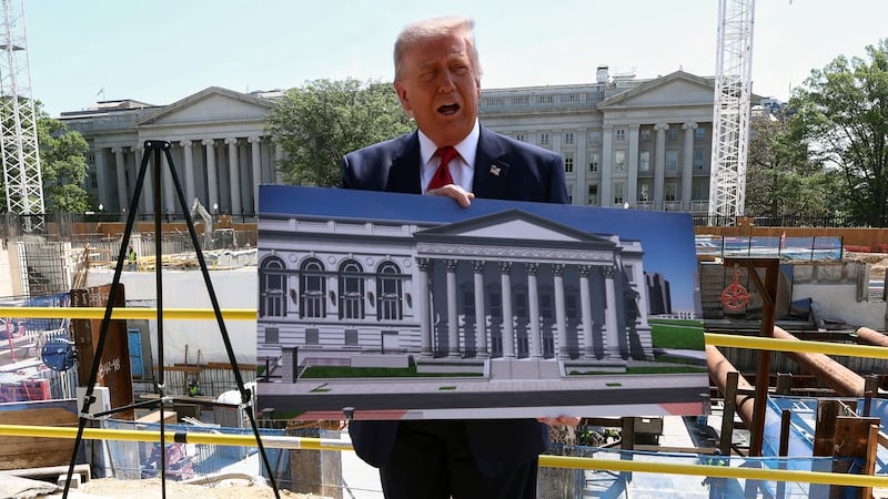 President Donald Trump said he was using this placard to hide his torso before laughing that the press saw enough of it during his trip to China.