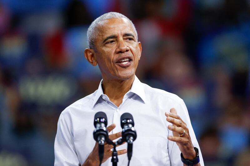 Former US President Barack Obama gestures as he speaks at a campaign rally with Minnesota Governor and Democratic vice presidential candidate Tim Walz in support of Vice President and Democratic presidential candidate Kamala Harris at Alliant Center in Madison, Wisconsin, on October 22, 2024. (Photo by KAMIL KRZACZYNSKI / AFP) (Photo by KAMIL KRZACZYNSKI/AFP via Getty Images)