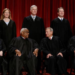 FILE PHOTO: U.S. Supreme Court justices pose for their group portrait at the Supreme Court in Washington, U.S., October 7, 2022. Seated (L-R): Justices Sonia Sotomayor, Clarence Thomas, Chief Justice John G. Roberts, Jr., Samuel A. Alito, Jr. and Elena Kagan. Standing (L-R): Justices Amy Coney Barrett, Neil M. Gorsuch, Brett M. Kavanaugh and Ketanji Brown Jackson. REUTERS/Evelyn Hockstein/File Photo
