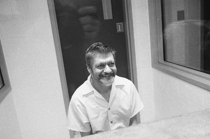 Ted Kaczynski sits and smiles during an interview in a visiting room at the Federal ADX Supermax prison in Florence, Colorado, August 30, 1999.