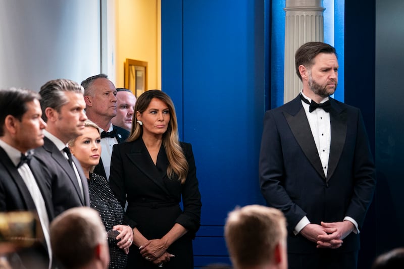 WASHINGTON, DC - APRIL 25: U.S. Secretary of State Marco Rubio, from left, U.S. Secretary of War Pete Hegseth, White House press secretary Karoline Leavitt, first lady Melania Trump, and U.S. Vice President J.D. Vance listen as U.S. President Donald Trump (not pictured) speaks during a press conference in the Brady Briefing Room of the White House on April 25, 2026 in Washington, DC. President Trump is making a statement after the cancelation of the annual White House Correspondents Association Dinner after a possible shooting. (Photo by Al Drago/Getty Images)