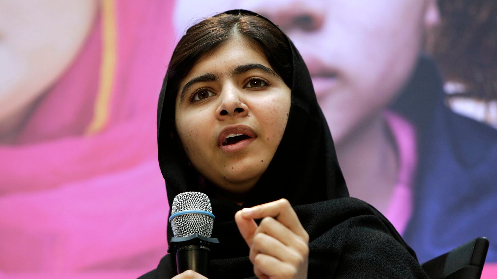 articles/2013/10/12/malala-s-fight-for-a-modern-pakistan/131012-haqqani-malala-tease_snbh3f