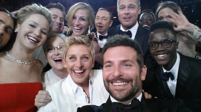 Host Ellen DeGeneres poses for a selfie taken by Bradley Cooper with Jared Leto, Jennifer Lawrence, Channing Tatum, Meryl Streep, Julia Roberts, Kevin Spacey, Brad Pitt, Lupita Nyong'o, Angelina Jolie, Peter Nyong'o Jr. and Bradley Cooper during the 86th Annual Academy Awards at the Dolby Theatre on March 2, 2014, in Hollywood, California.