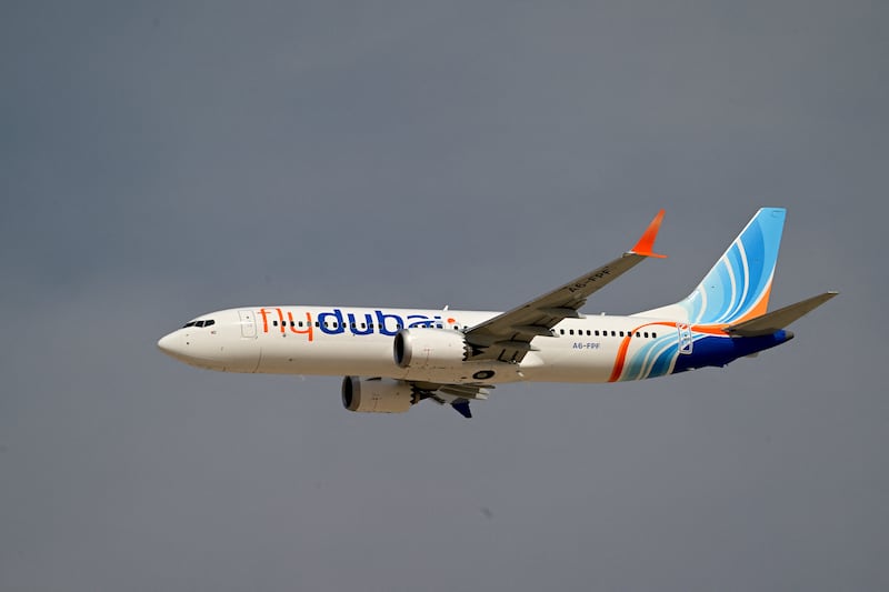 A Flydubai Boeing 737 MAX 8 performs a display flight at Al-Maktoum International Airport during the Dubai Airshow 2025 in Dubai on November 17, 2025. (Photo by Giuseppe CACACE / AFP) (Photo by GIUSEPPE CACACE/AFP via Getty Images)