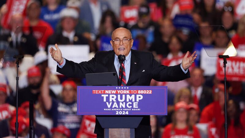 Former mayor of New York City and former Trump lawyer Rudy Giuliani gestures as he speaks at the Nassau Veterans Memorial Coliseum during a rally held by Republican presidential nominees and former U.S. President Donald Trump, in Uniondale, New York, U.S., September 18, 2024. REUTERS/Brendan McDermid
