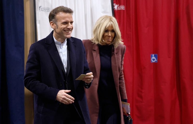 Emmanuel Macron and his wife Brigitte Macron vote during the first round of France's municipal elections in Le Touquet-Paris-Plage, France, Sunday, March 15, 2026.