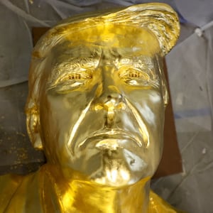Detail of a 15-foot-tall gold-leafed bronze statue of U.S. President Donald Trump, designed by sculptor Alan Cottrill, at his studio in Zanesville, Ohio, U.S., February 10, 2026. REUTERS/Eric Cox