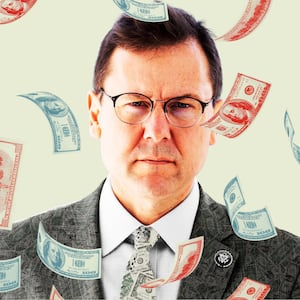 Tom Kean with money falling around him