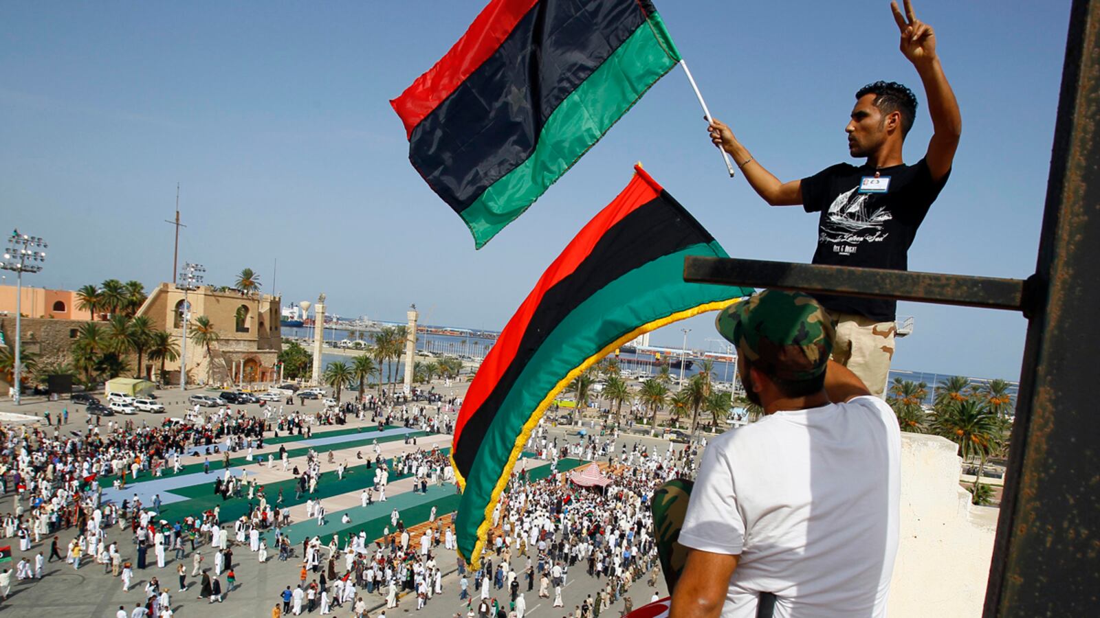 articles/2011/10/23/libya-declares-freedom-after-gaddafi-s-death-photos/libya-wrap-tease_mnzkp4