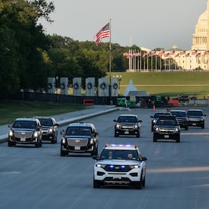 Donald Trump's motorcade drives on the Lincoln Memorial Reflecting Pool as it undergoes renovations, with the Washington Monument and U.S. Capitol building in the background, in Washington, D.C., U.S., May 7, 2026.