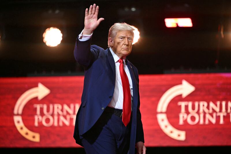 US President Donald Trump waves after speaking at the public memorial service for right-wing activist Charlie Kirk at State Farm Stadium in Glendale, Arizona, on September 21, 2025. (Photo by Mandel NGAN / AFP) (Photo by MANDEL NGAN/AFP via Getty Images)