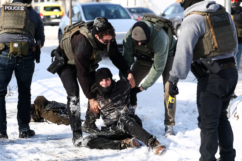 Federal agents detain a protester in Minneapolis, Minnesota on February 3, 2026.