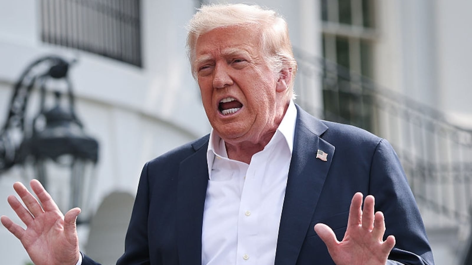WASHINGTON, DC - JULY 11: U.S. President Donald Trump answers questions while departing the White House on July 11, 2025 in Washington, DC. Trump is scheduled to travel to Central Texas today to meet with first responders and local elected officials involved with the recovery process from last week's flash flooding event that has claimed more than 120 lives. (Photo by Win McNamee/Getty Images)