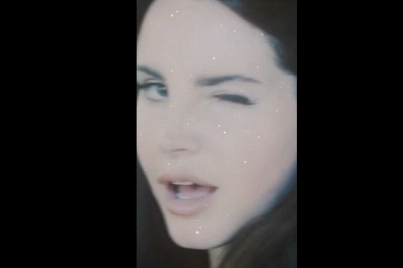 Lana Del Ray winking.