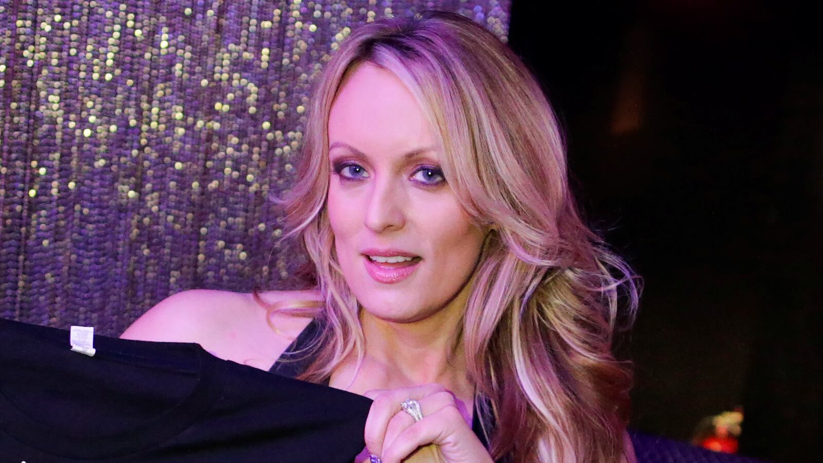 Adult-film actress Stephanie Clifford, also known as Stormy Daniels, poses for pictures at the end of her striptease show.